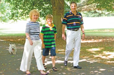 Ambassador of the Russian Federation Yuri Ushakov, his wife Svetlana and grandson Misha, followed by dog Simon, stroll the lushly planted grounds of the Eastern Shore dacha.